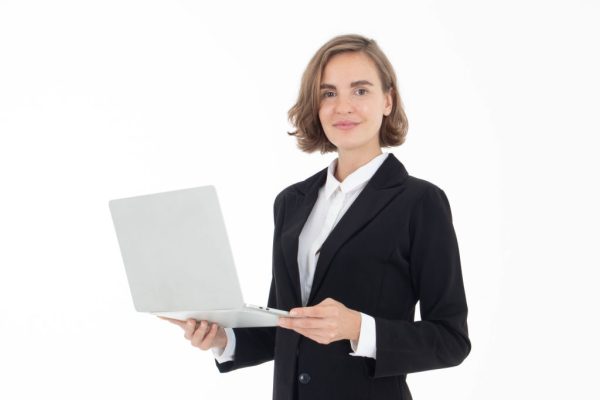 Portrait of young business woman holding laptop with hand pointing up , isolated on white background